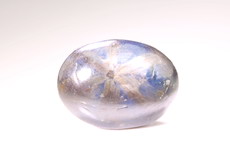 Blau / bronzefarbener Trapiche Saphir Cabochon 