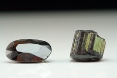 Faceted Painite and cutting- grade Crystal