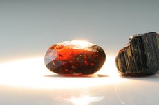 Faceted Painite and cutting- grade Crystal