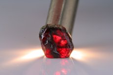 Faceted Painite and cutting- grade Crystal