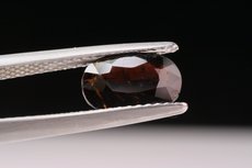 Faceted Painite and cutting- grade Crystal