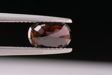 Faceted Painite and cutting- grade Crystal